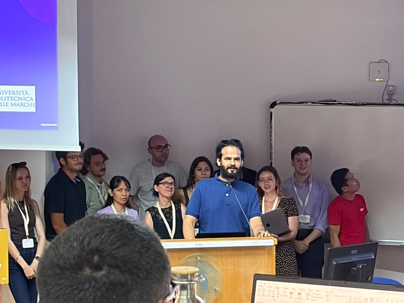 Sadashiv Chaturvedi at a lectern with fellow researchers at Universita Politecnica delle Marche