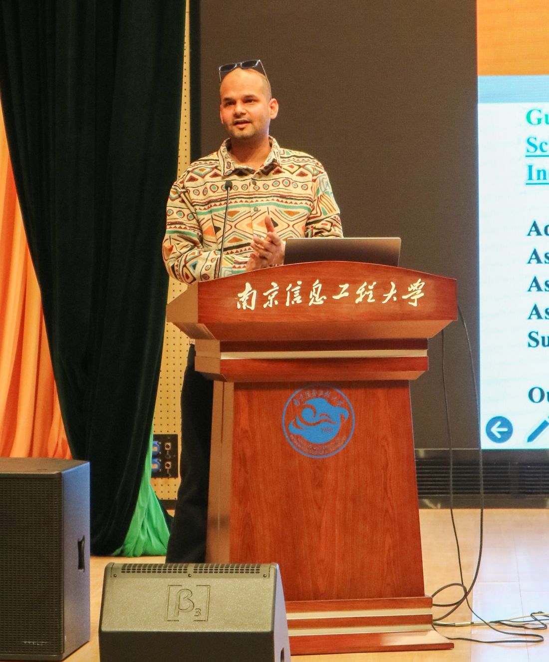 Sadashiv Chaturvedi speaking at a lectern at Nanjing University of Information Science and Technology